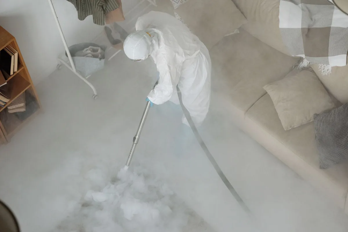 Biohazard cleanup technician in protective equipment, Barrackville, WV